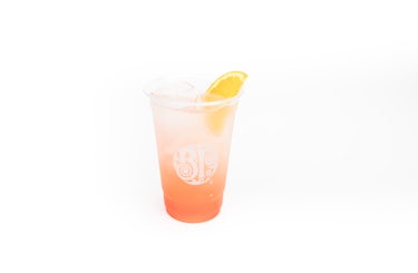 image of fly me to hawaii drink with lemon garnish.