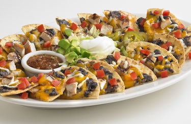 A platter of Boston's Nachos with diced chicken.