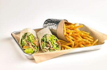Photo of Chicken caesar wrap with fries.